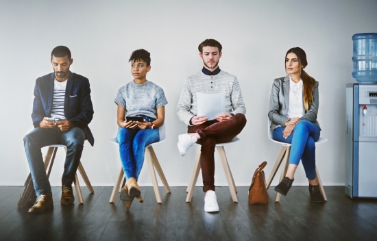 Shot of a group of young businesspeople waiting in line for a job interview - www.daval.uk